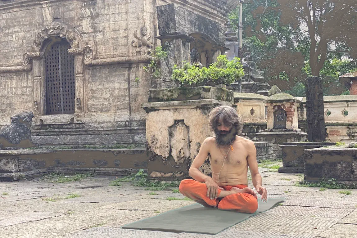 Yogi Ji seated in stillness on the stone paving among the old shrines of the Pashupatinath complex.