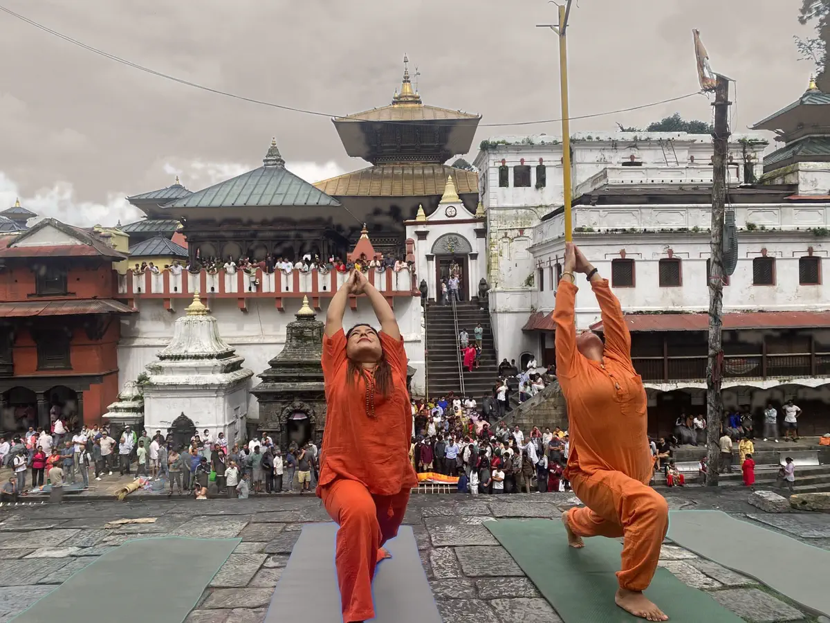 Yogi Ji practising alongside two students in the courtyard at Pashupatinath, Kathmandu.
